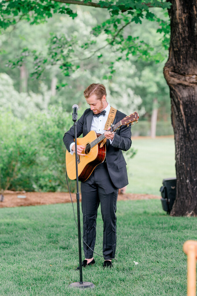 guitar player at outdoor garden wedding