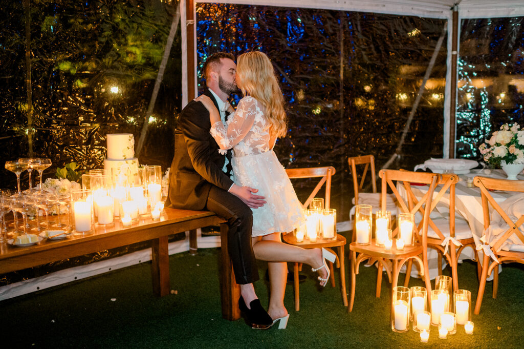 romanic kiss candle lit tented garden wedding