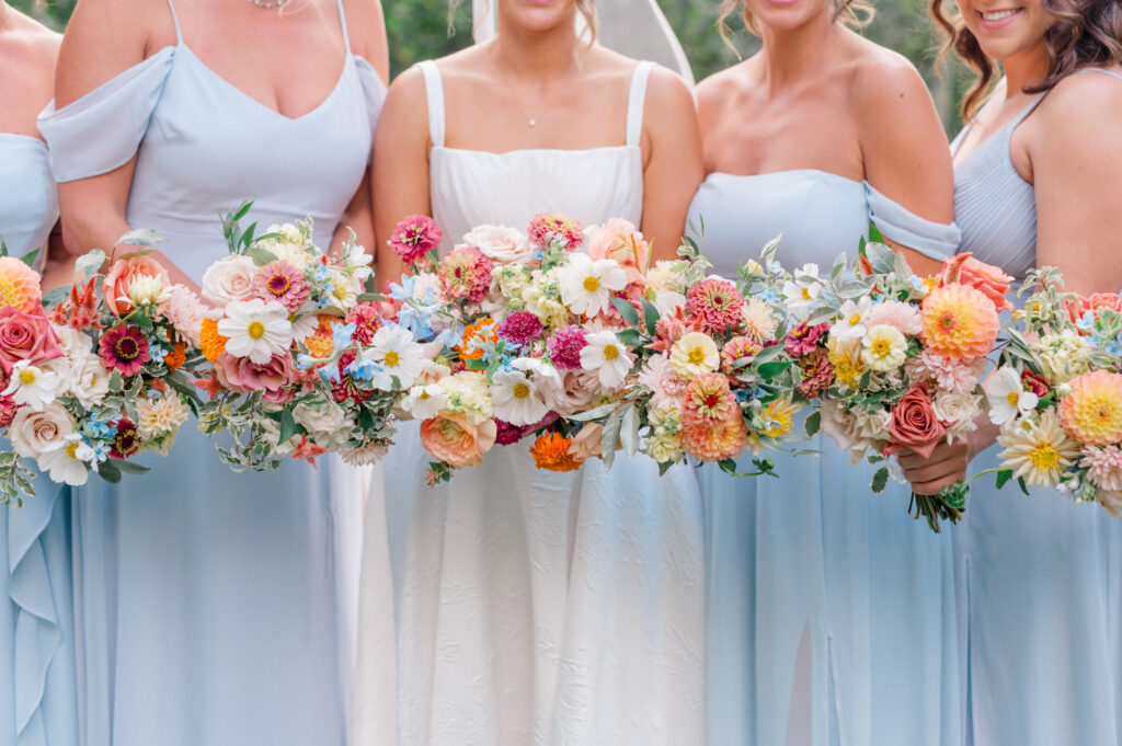 bright florals and blue bridesmaid dresses