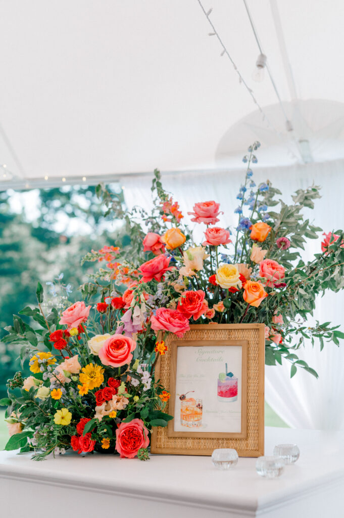 bright florals and signature cocktail sign