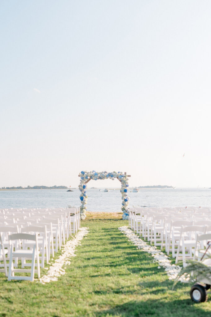 outdoor wedding ceremony by the water at the point at norwalk cove