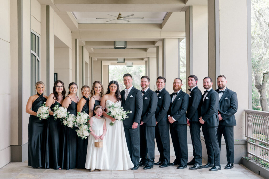 Bride and groom pose with bridal party. 