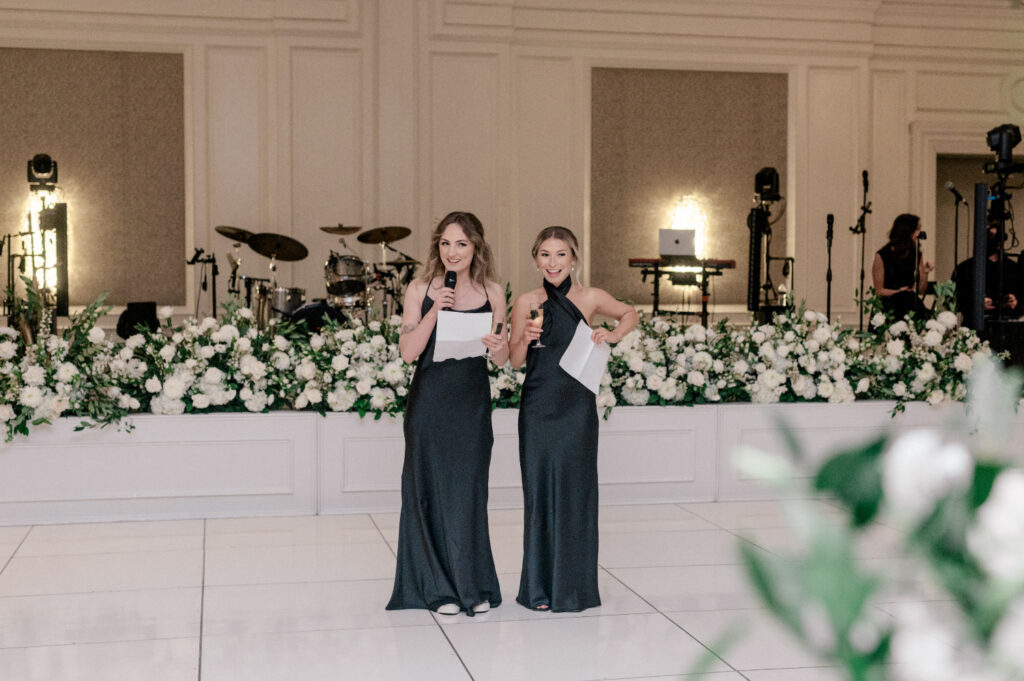 Two bridesmaids make a toast together during wedding at the Ritz Carlton Amelia Island. 