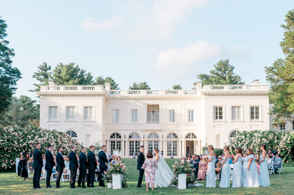 Outdoor wedding ceremony at Wadsworth Mansion, one of the best wedding venues in Connecticut, showcasing the beautifully landscaped grounds and the mansion as the backdrop.