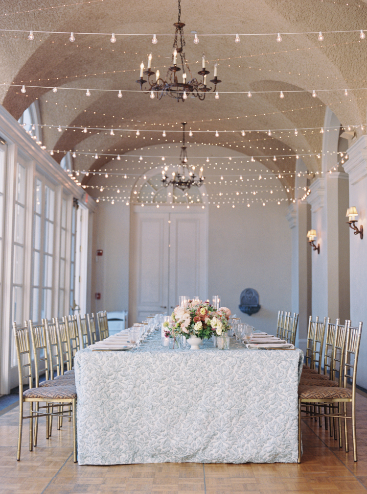 Hanging lights and chandelier over the dinner table 