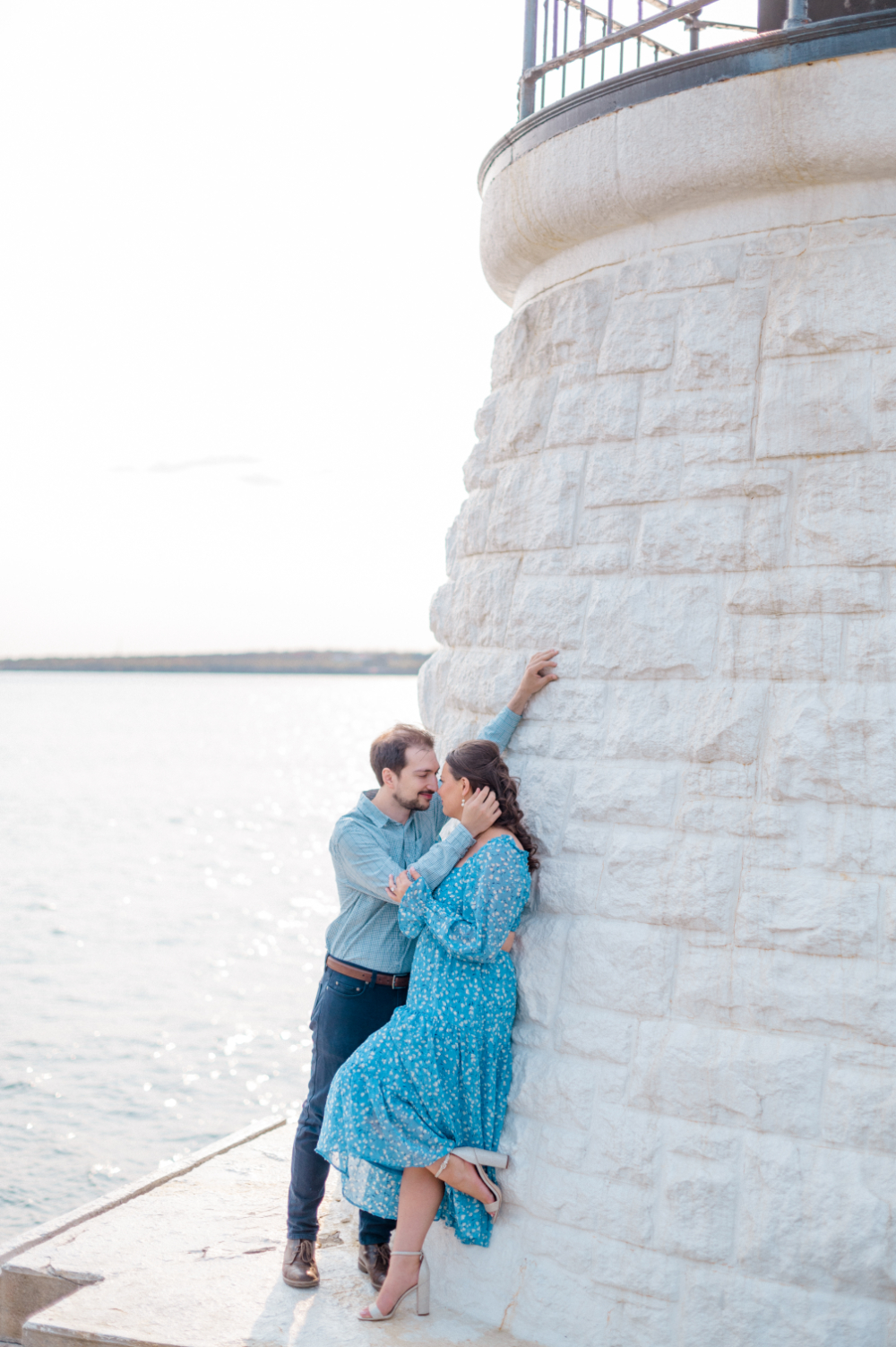 couple engagement photo by the water 