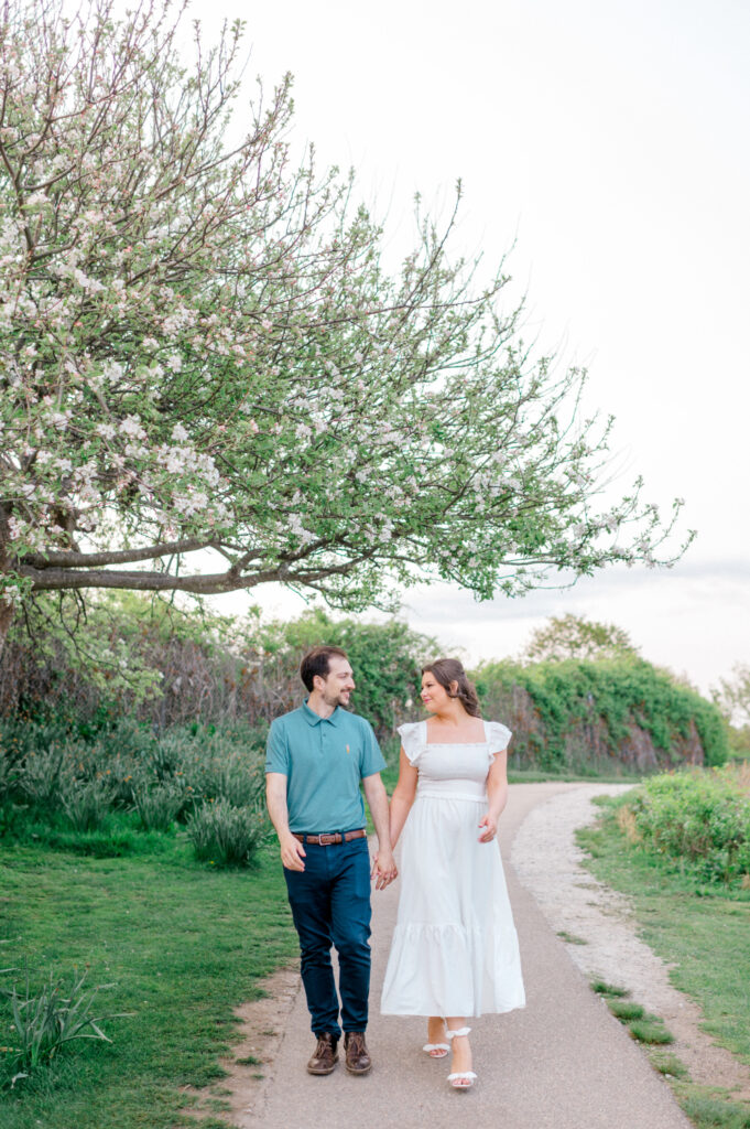 how to plan your engagement photos, couple walking along a path