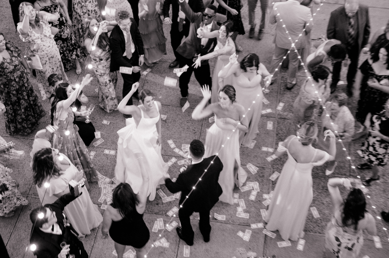 Bride and groom dancing at their reception with all their guests at their wedding at Wadsworth Mansion