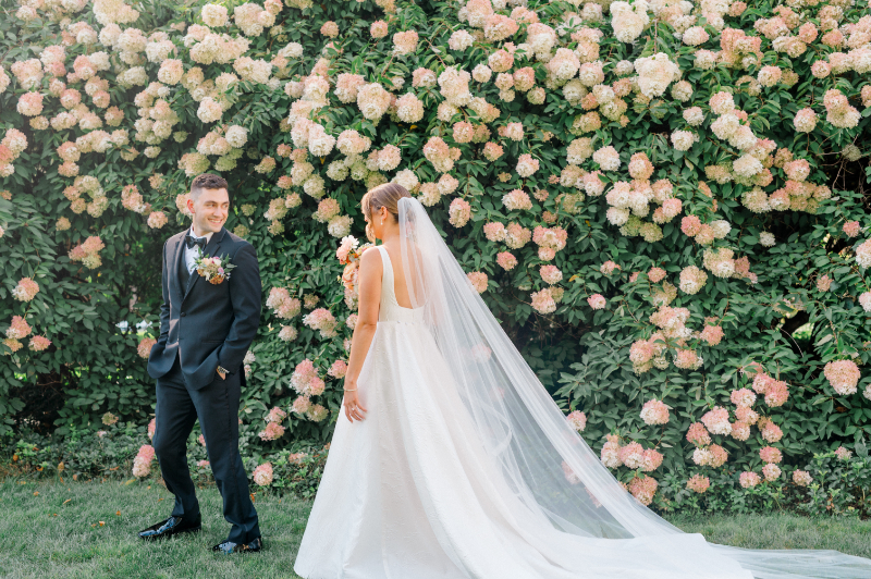 Bride and groom share a first look in the garden before their vows 