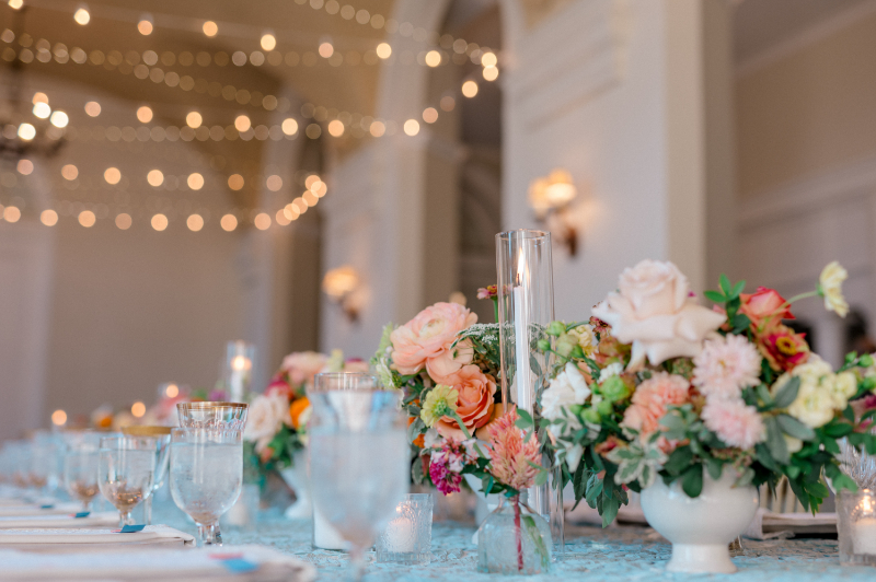 Stunning tablescapes with florals and candles at their wedding at Wadsworth Mansion