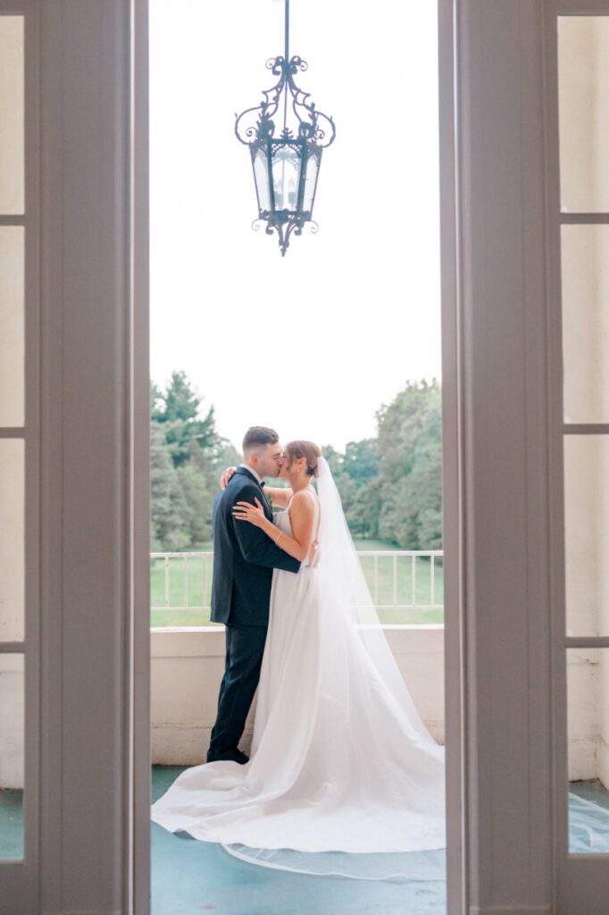 couple kissing during their wedding at Wadsworth mansion