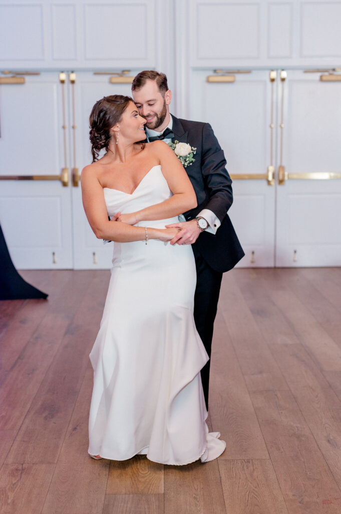 Bride and groom sharing a romantic first dance at their Newport Harbor Island Resort wedding reception.