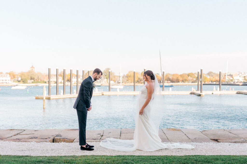 Groom beaming as he lays eyes on his bride, the ocean view behind them adding to the magic of the moment.