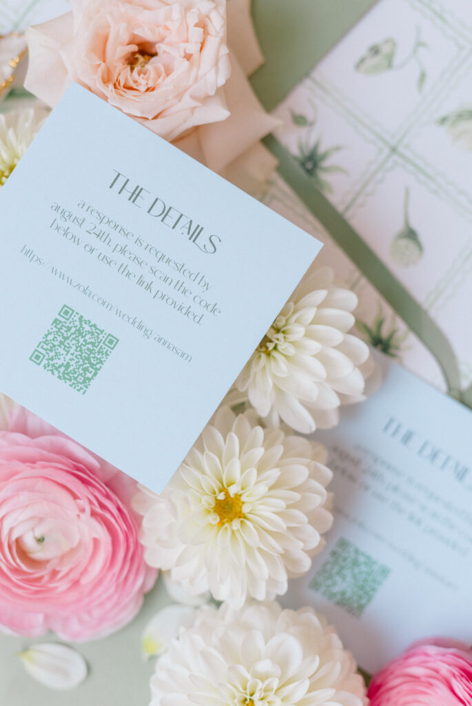 Soft blue wedding detail card nestled among pastel florals for a romantic Connecticut wedding day, captured by Jennifer Nichole Photography.