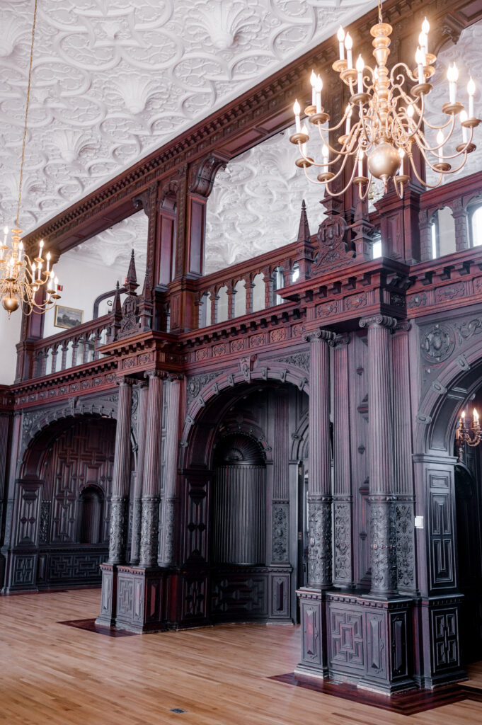 Ornate wood paneling and detailed plaster ceiling at Branford House wedding venue in Connecticut