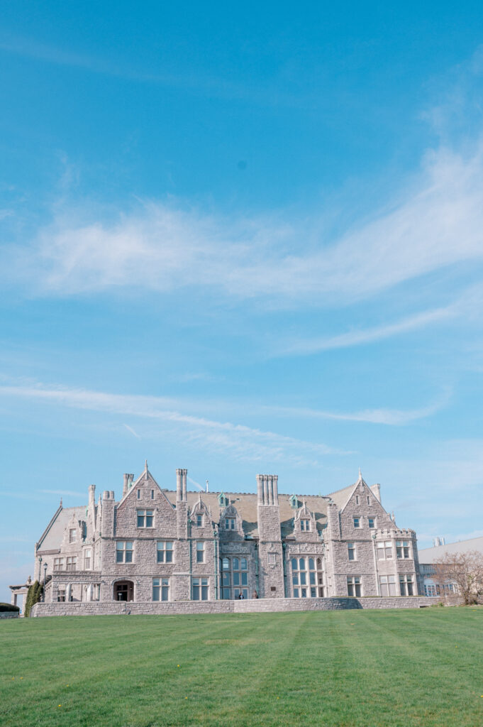 Branford House wedding venue with sweeping green lawn and clear blue Connecticut sky, perfect for outdoor ceremonies
