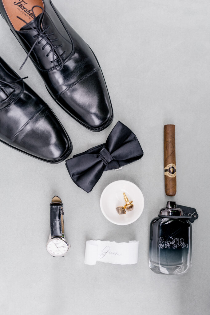 Groom's polished black dress shoes and formal wedding accessories styled for a Smith Farm Gardens wedding morning