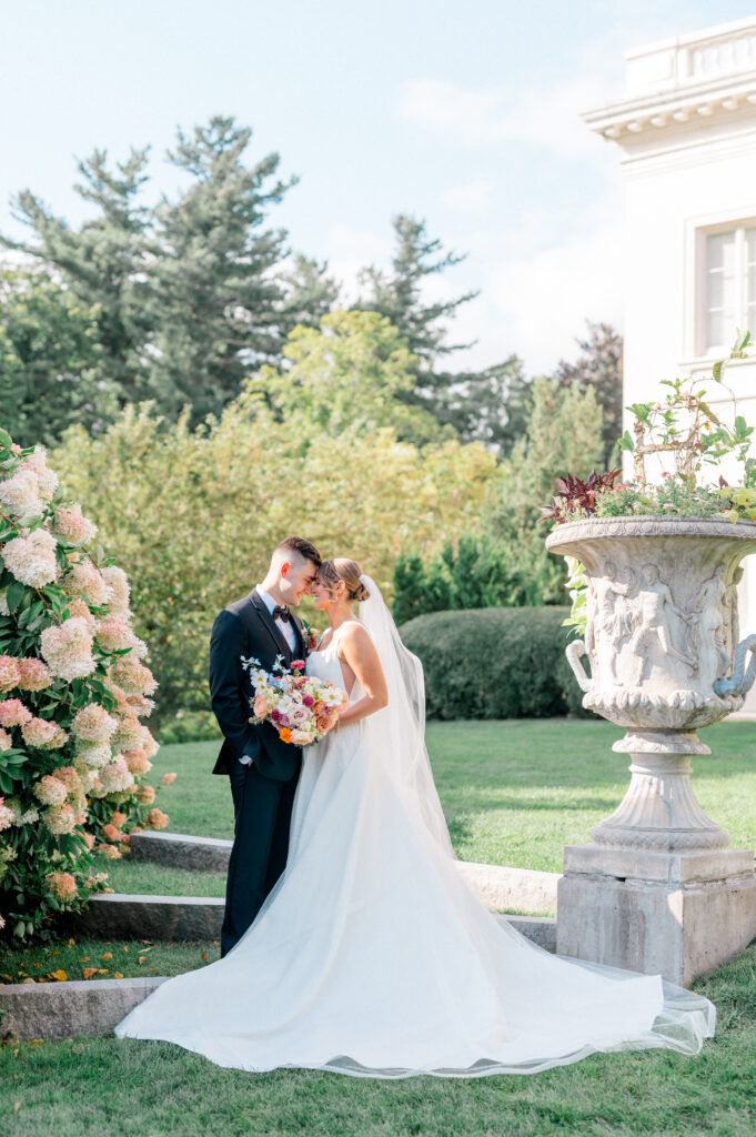 Bride and groom embrace in the garden at Wadsworth Mansion wedding, captured by Connecticut wedding photographer Jennifer Nichole & Co.